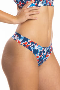 A woman wearing The Grand Finale USA Camouflage Seamless Thong.