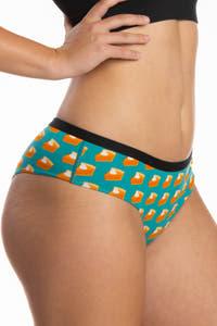 A woman wearing pumpkin pie cheeky underwear.