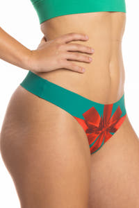 A woman wearing The Unwrap Me | Christmas Present Seamless Thong.
