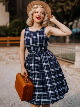 woman in vintage plaid dress and briefcase