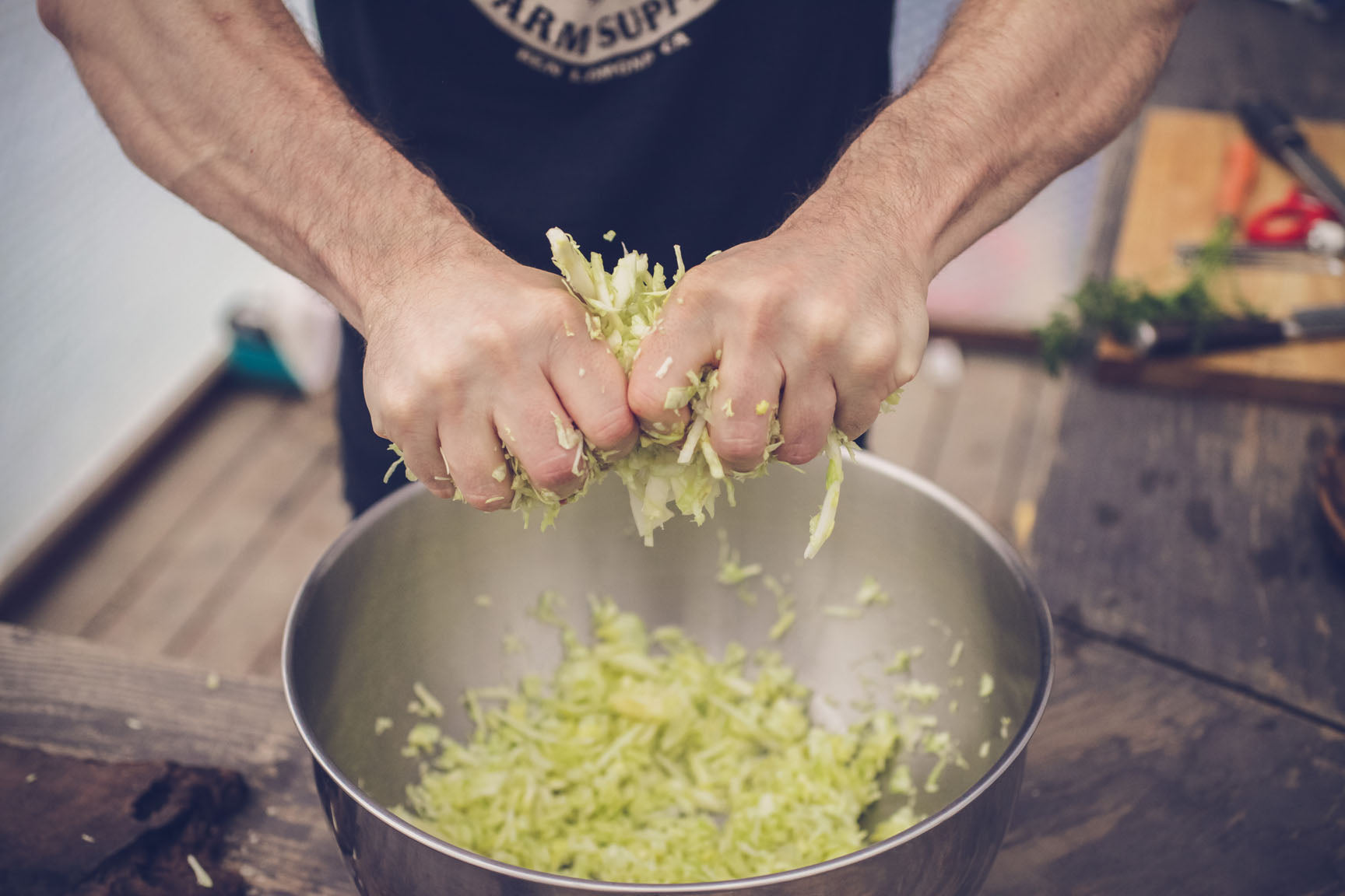 squeeze cabbage to create brine