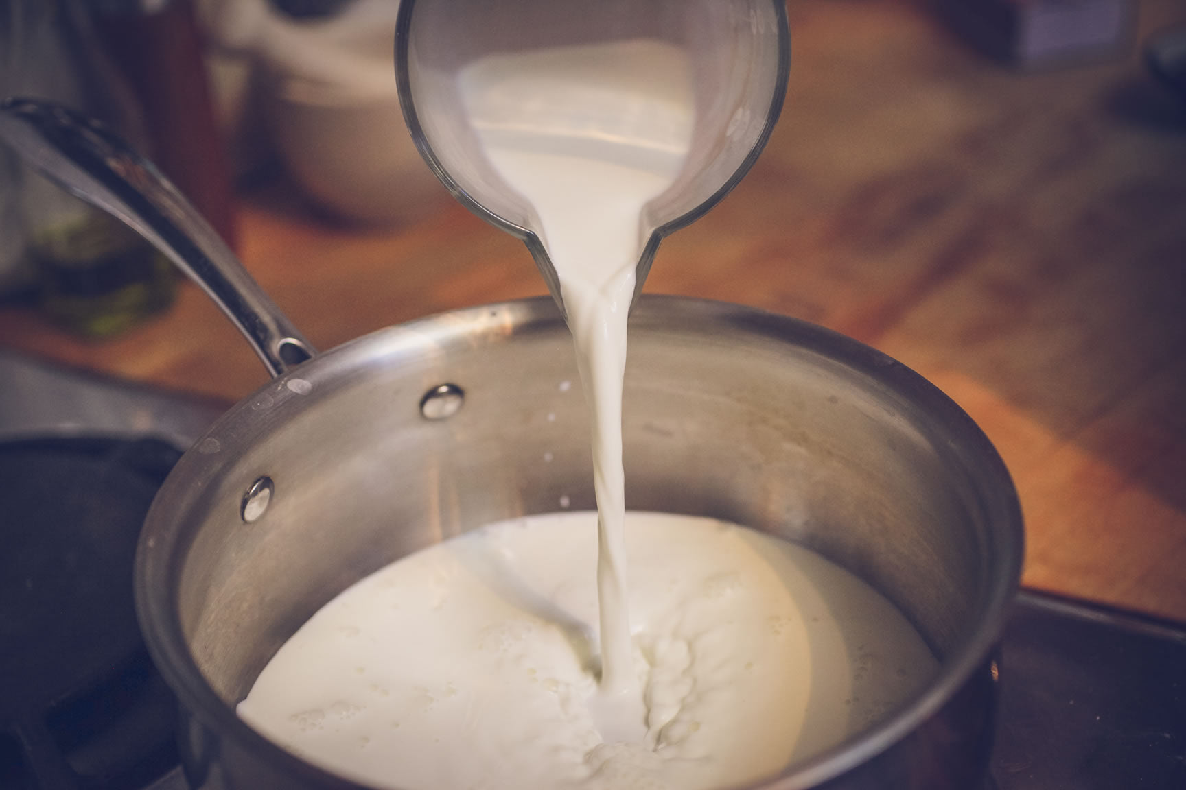 pour milk in saucepan