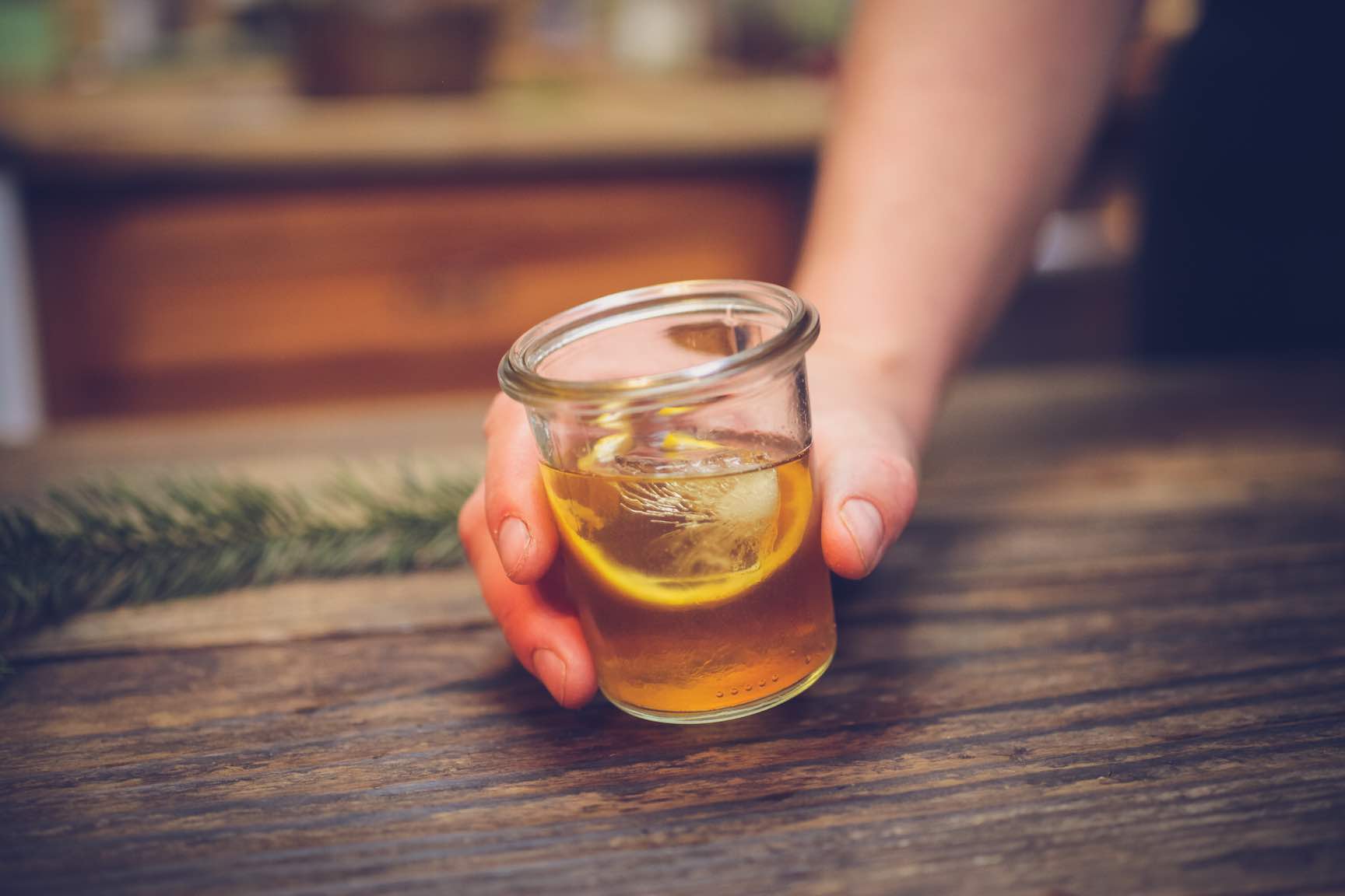 making a homemade old fashioned cocktail with tree derived simple syrup