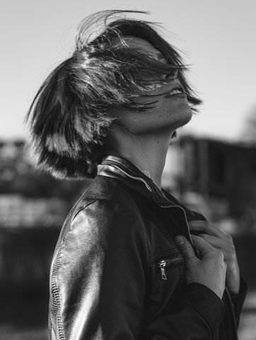 Punk woman in leather jacket in black and white