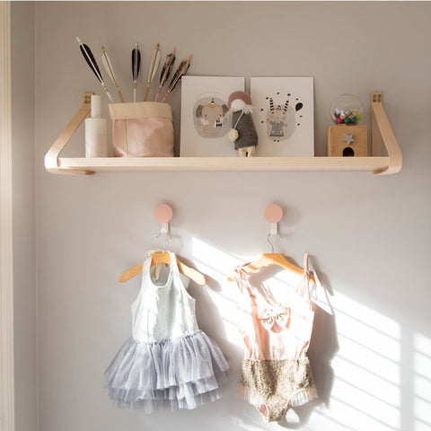 Leather strap and ply bookshelf. 