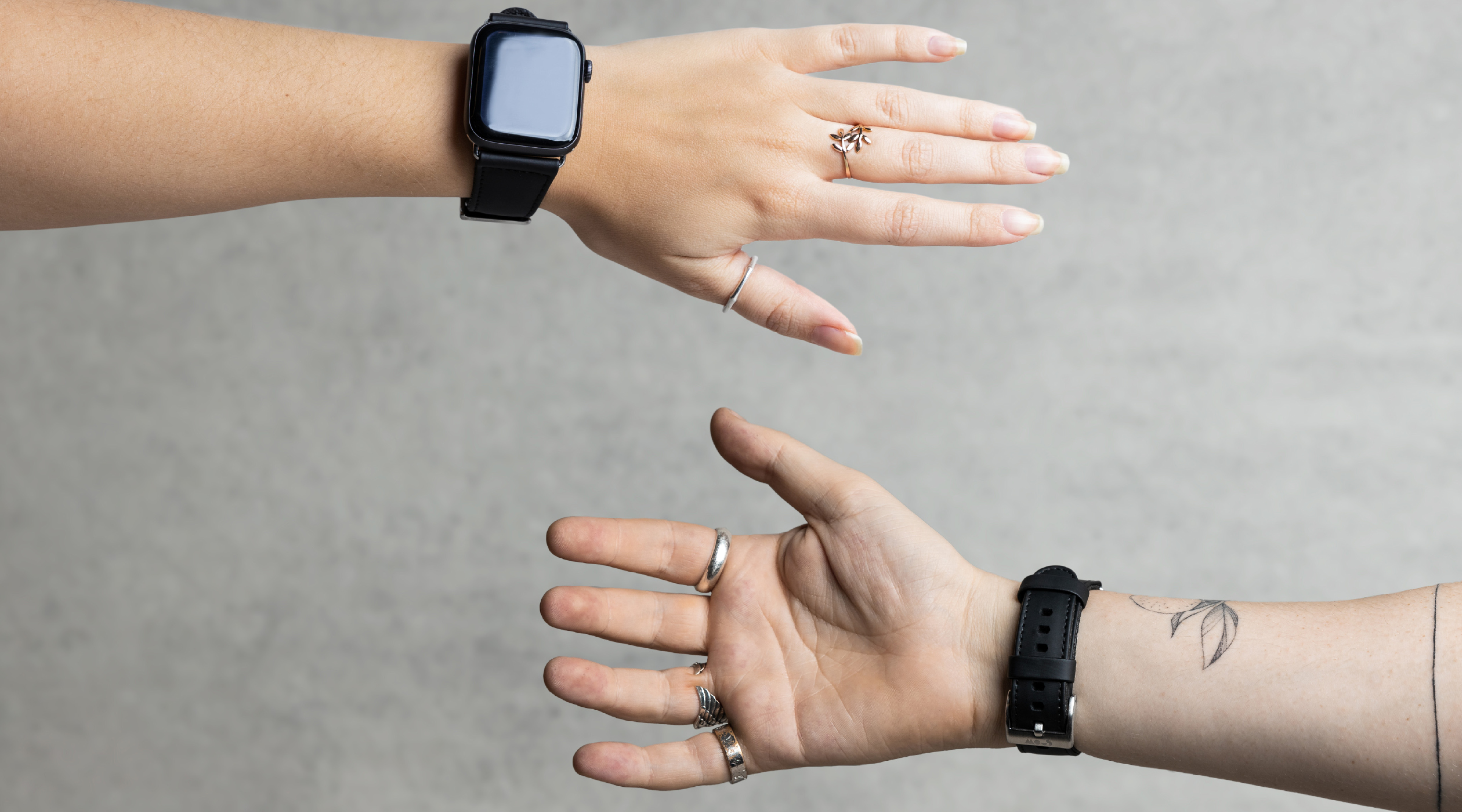 A man and woman wearing Mous Apple Watch straps close up of their arms