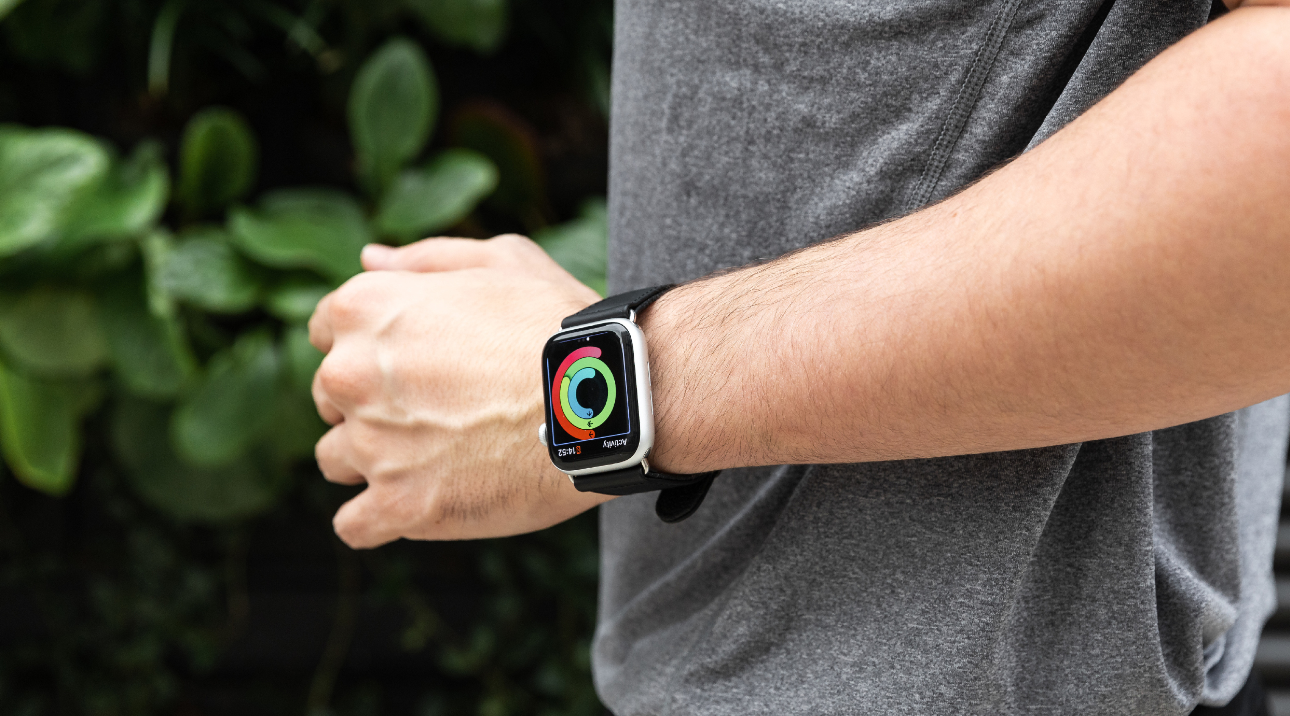 Man wearing a Mous Apple Watch strap doing exercise outside close up