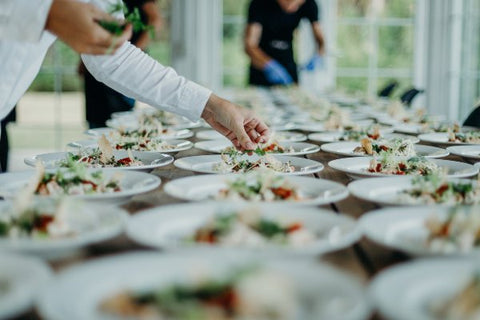 A chef prepares sustainable food for a wedding