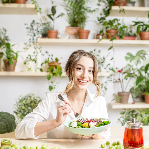 woman with green fruits & veggies