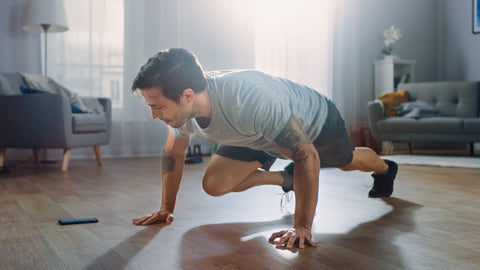 man doing hiit workout at home