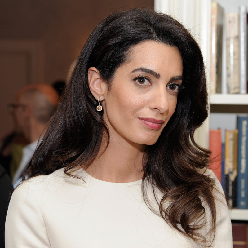 Human rights lawyer Amal Clooney i is an inspiration to Prosperity Candle's women refugees pouring fair trade handmade soy candles