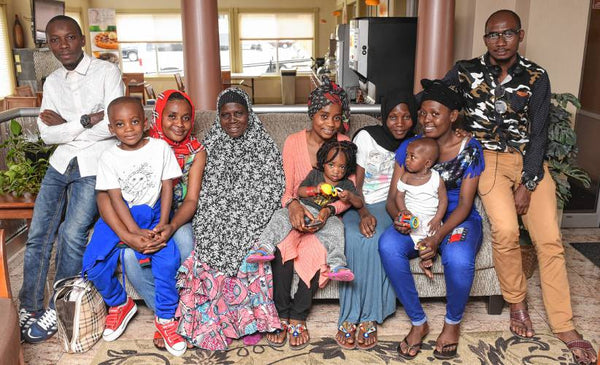 Artisan candle-maker Nyota and her loved ones after resettling to the U.S. from a refugee camp in Burundi