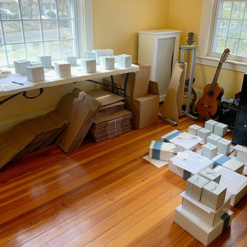 Co-owners make-shift shipping and packing room from their home.