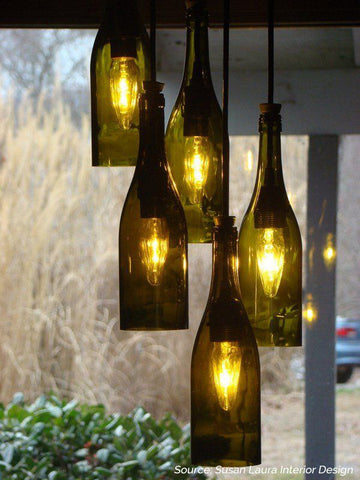 DIY wine bottle lamps hanging outdoors - 5 Creative Upcycling Ideas to Style your Home Sustainably on Prosperity Candle Blog