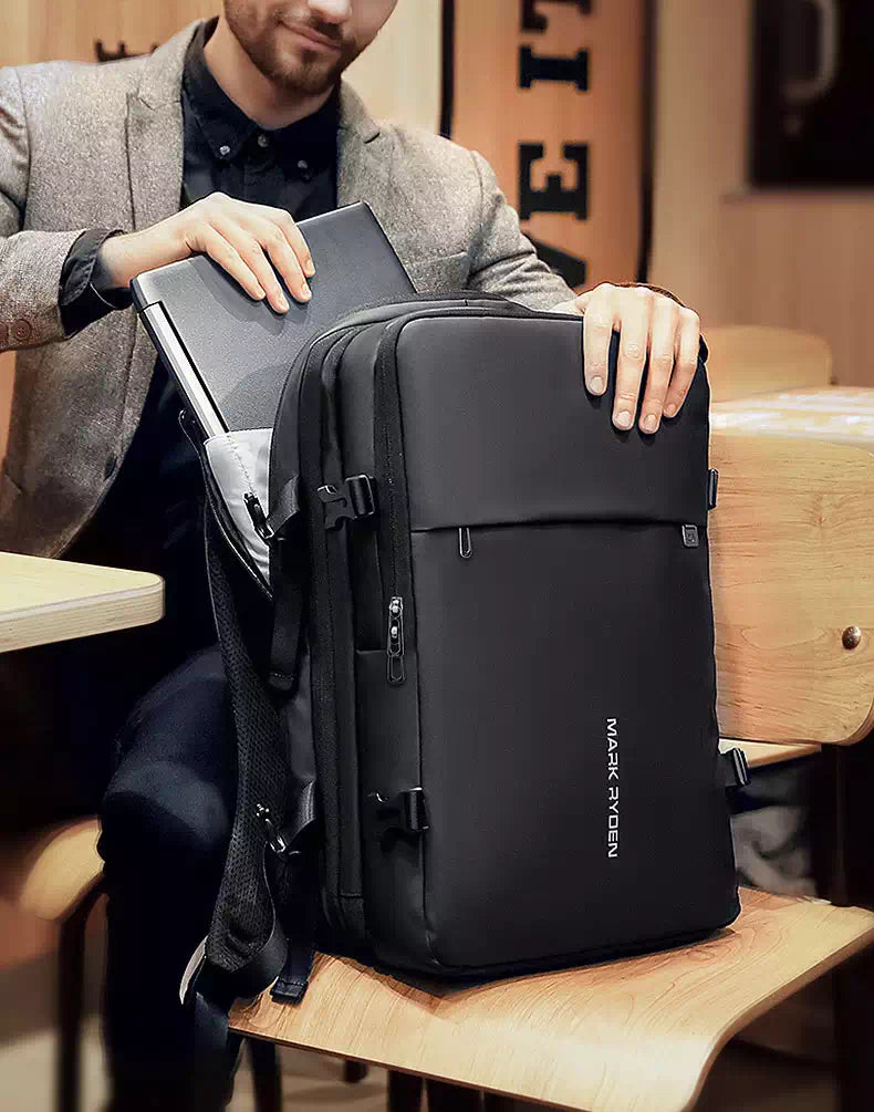 Black travel backpack with expandable feature and charging port