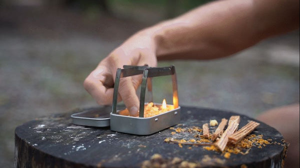 A stainless steel camping wood burning stove that burns multiple fuels. This micro wood stove for camping can fit into a wallet, or altoids tin stove.