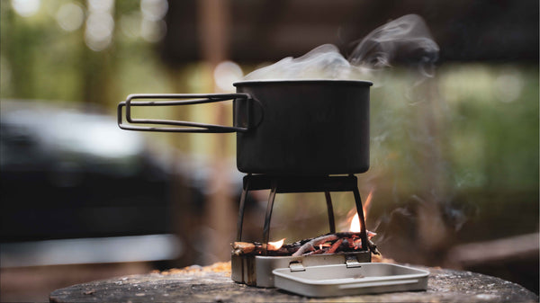 A stainless steel camping wood burning stove that burns multiple fuels. This micro wood stove for camping can fit into a wallet, or altoids tin stove.