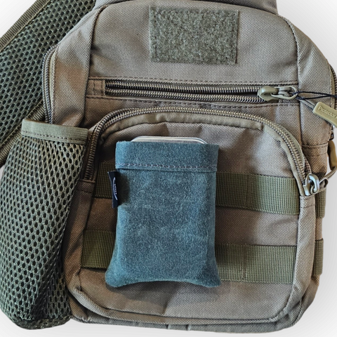 A waxed canvas pouch used as an edc belt pouch or edc molle pouch that is designed to hold altoids tins