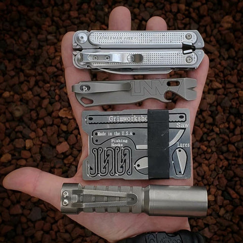 The Grim Workshop Survival Wallet. A multi tool wallet with minimalist survival kit cut into it's surface.
