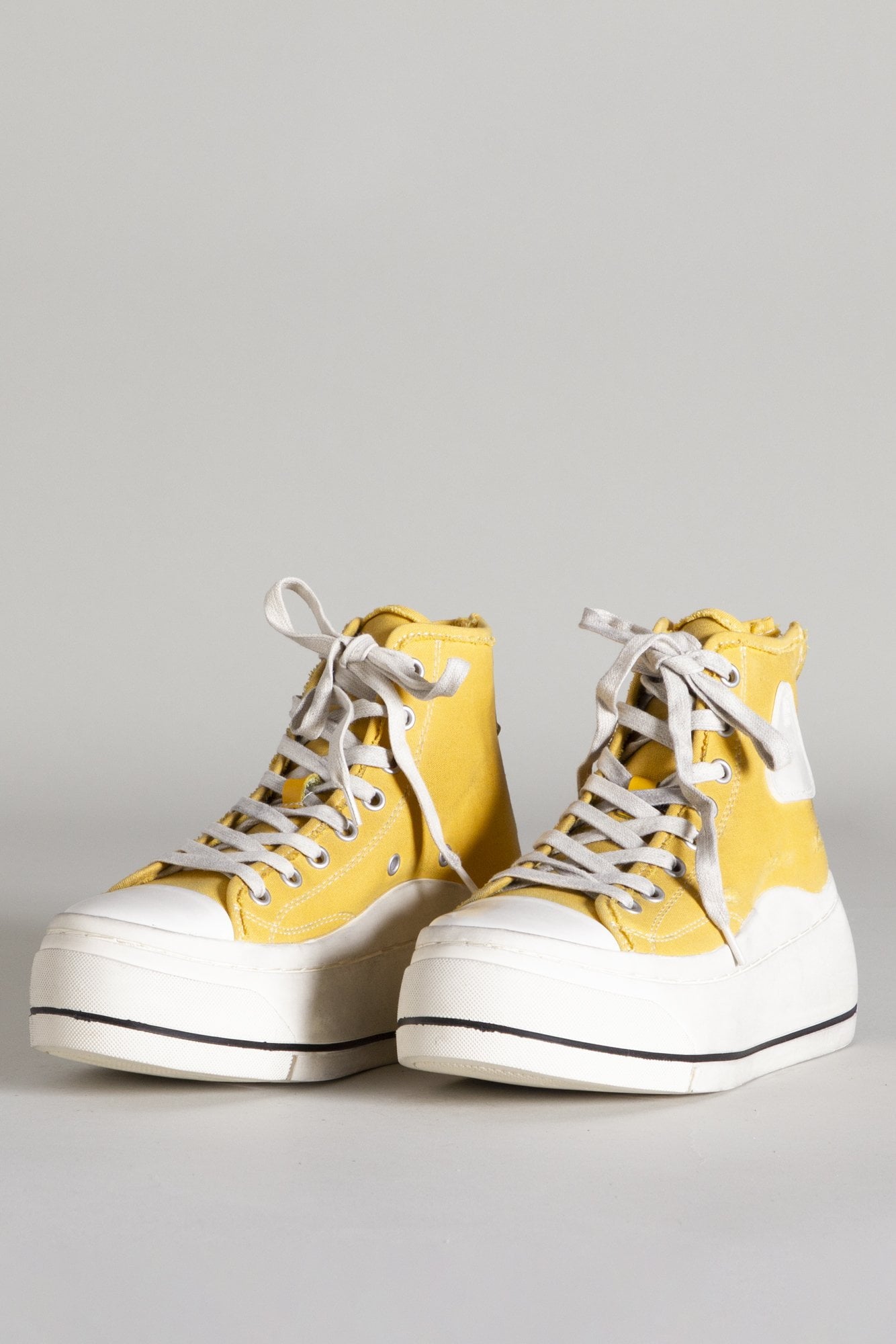 white and gold high top sneakers