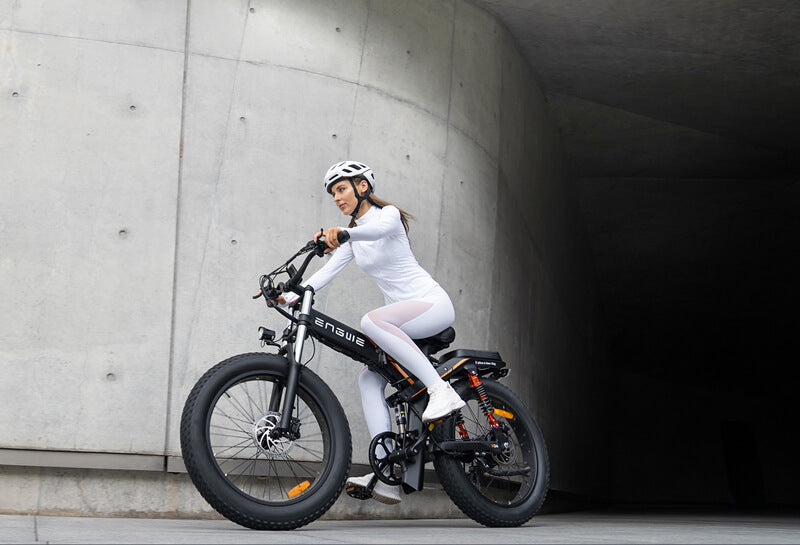 a woman rides an engwe x24