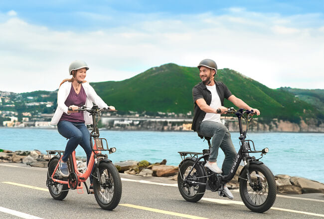 2 people ride 2 fat tire folding electric bikes engwe l20 2.0 on the road