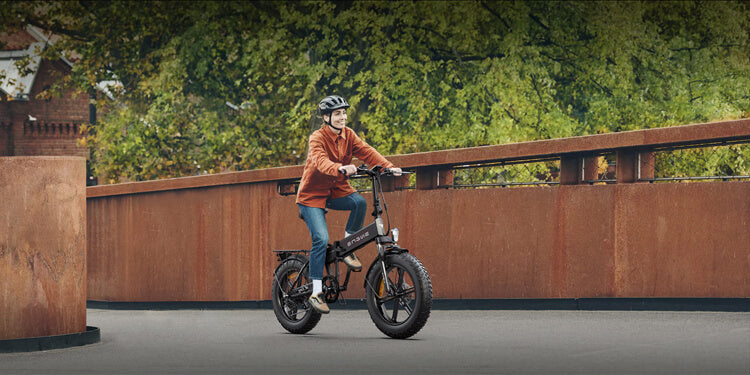 a woman wearing an electric bike helmet rides an engwe ep-2 pro e-bike
