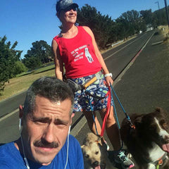 Patti with her two pups and husband, a fellow runner and her biggest inspiration.