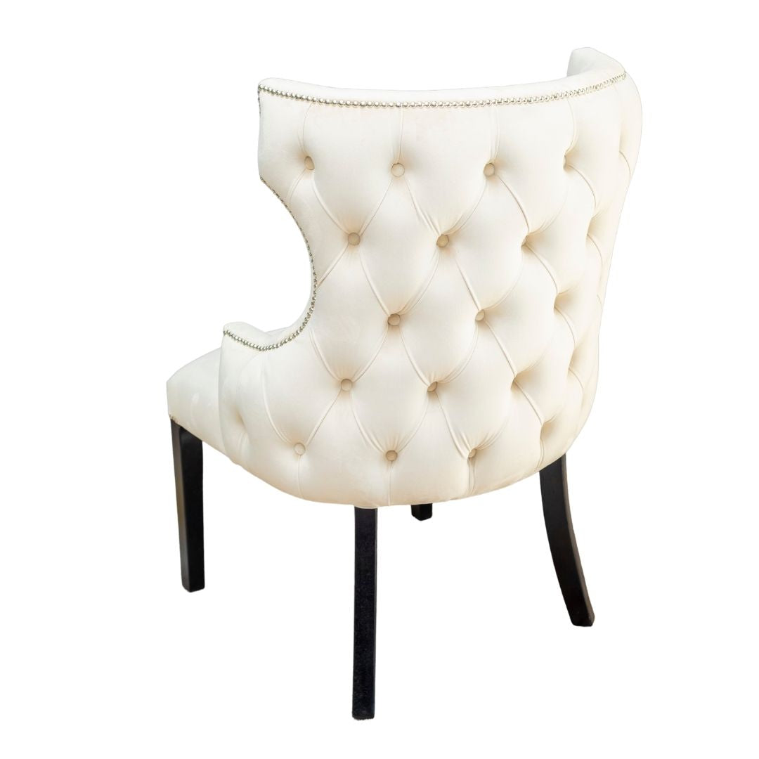 cream button back dining chairs