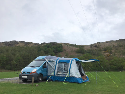 a campervan and a driveaway awning on a campsite in the Lake District