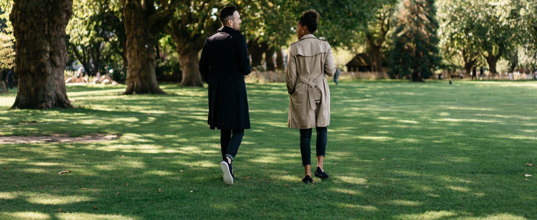 couple going for a walk in a park wearing slippers