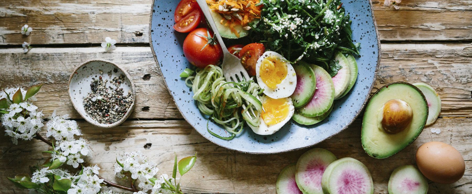 a healthy looking salad with avocado and eggs