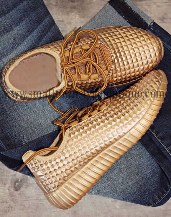 gold tennis shoes