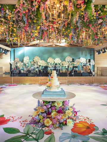 The Floral Motifs were incorporated onto the dance floor which laid below a gorgeous ceiling of cascading florals in rainbow hues. 