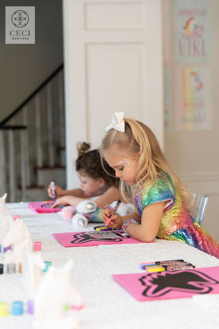 Elle painting her unicorn with friends. 