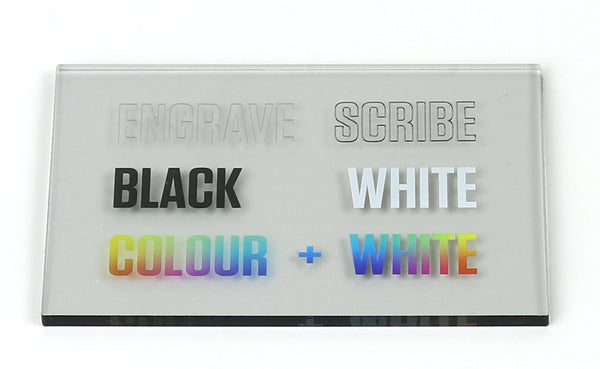 Photo of transparent white acrylic piece with colour printing and laser engraving