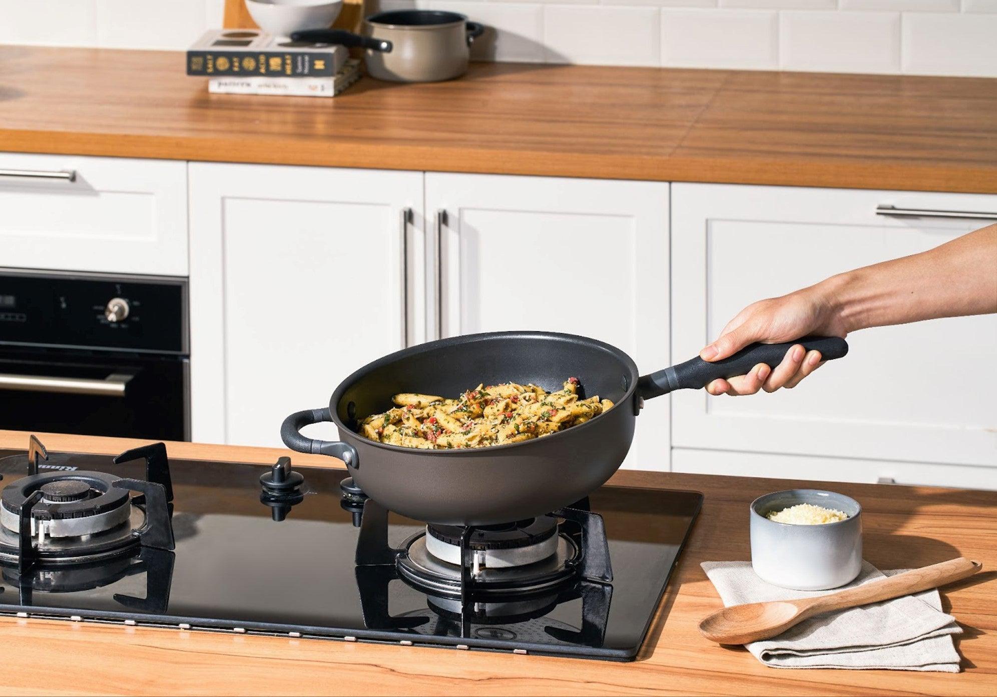 Cooking Penne Pasta on the stovetop with nonstick chefs pan versatile as skillet pan with deep and high curved side walls