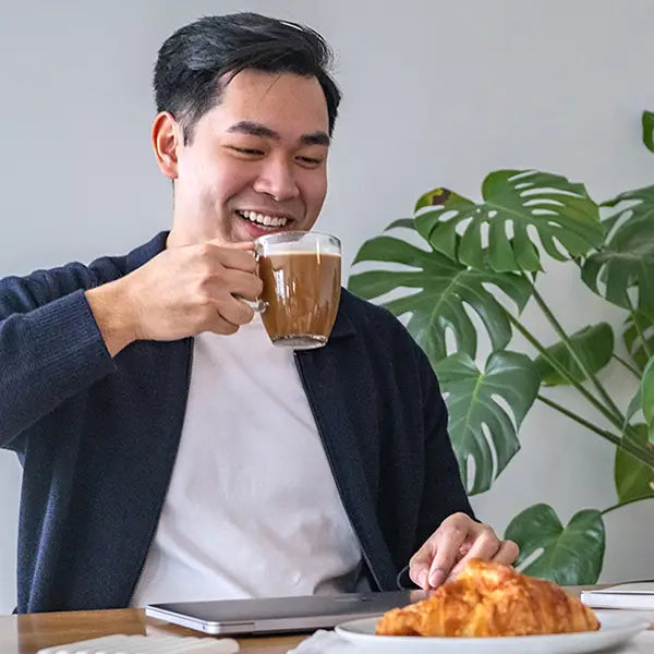 Man enjoying a glass of withinUs TruMarine® Collagen