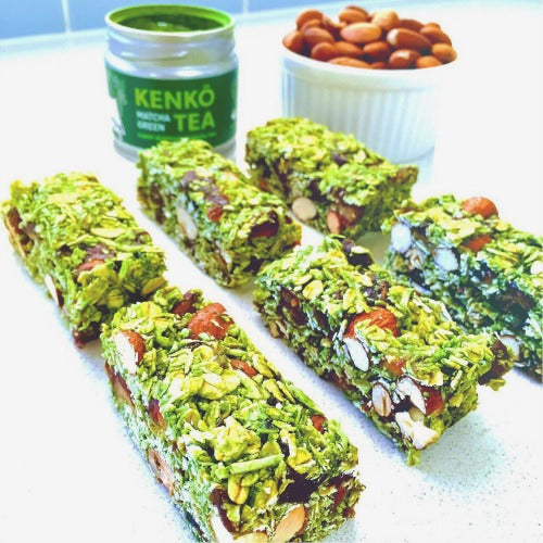 Vegan Raw Matcha Almond Muesli Bars with coconut, almond, rolled oats, dates, and malt syrup.