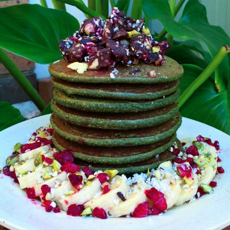 Vegan, dairy free, low fat Matcha pancakes recipe topped with dried fruits and nuts