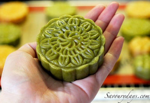 Beautiful and delicious matcha moon cakes filled with sweet and smooth red bean paste