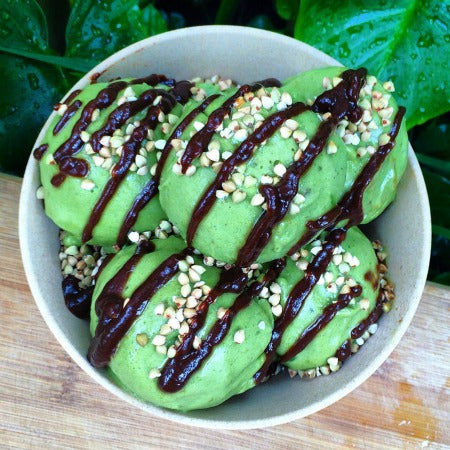 Matcha Vegan Green Tea Ice cream topped with buckinis and carob sauce