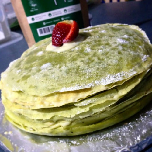 Thin, light matcha green tea crepes are layered with creamy custard filling to create the delicious stack of Matcha Crepe Cake
