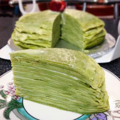 Matcha crepe cake layered with custard cream filling is the great breakfast or dessert for the family