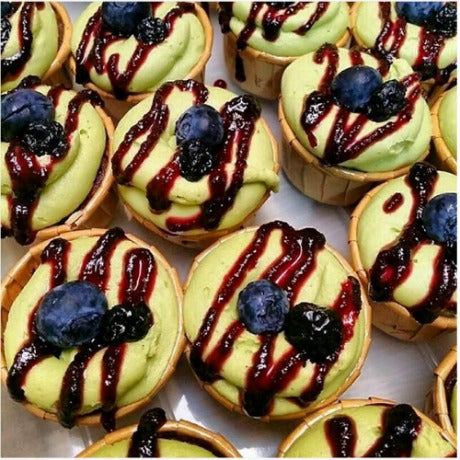 Blueberry cupcakes with matcha frosting and blueberry coulis