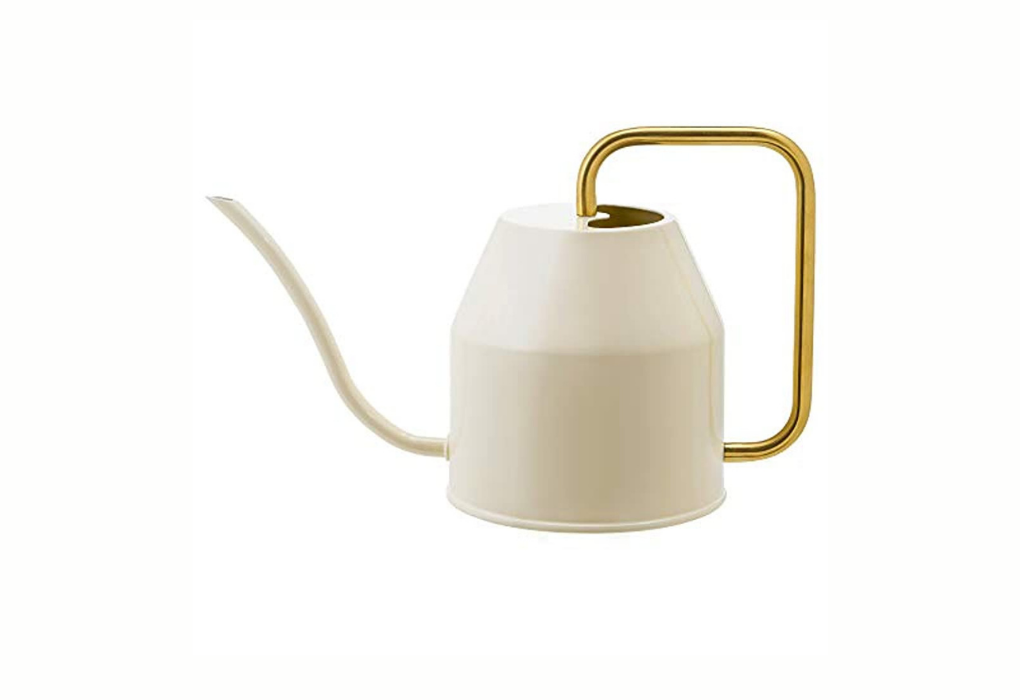 White and gold watering can