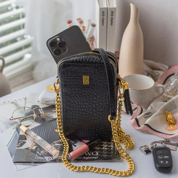 https://cdn.shopify.com/s/files/1/0240/2546/4909/products/croco-crossbody-phone-bag-926386_600x.webp?v=1700926349