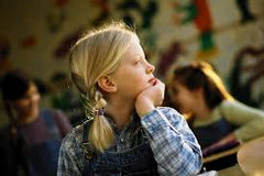 Child staring out of window