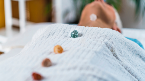 person enjoying chakra healing gemstone therapy