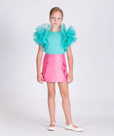 mint blouse with ruffled sleeves and pink skirt with ruffled pockets